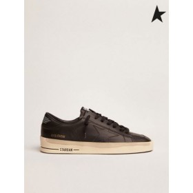 Golden Goose Stardan joggesko i sum sort skinn med vintage finish black gold farge
